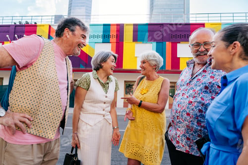 Preview: Group of senior friends meeting outddors in the city and having fun