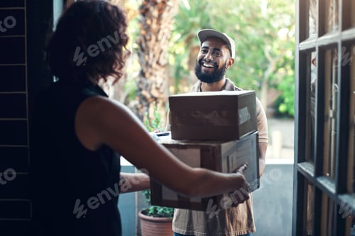 Preview: Shot of a handsome young man delivering parcels to a hairdresser at her salon