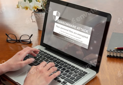 Preview: Ransom ware, Cyber attack. Warning message on a computer screen. Woman work with a laptop.