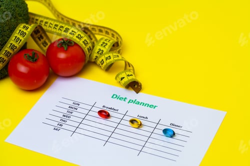 Preview: Diet plan for weight loss pills and fresh vegetables on yellow background.