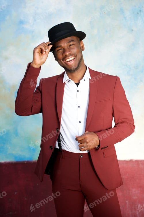 Preview: handsome young black man smiling with hat and vintage suit