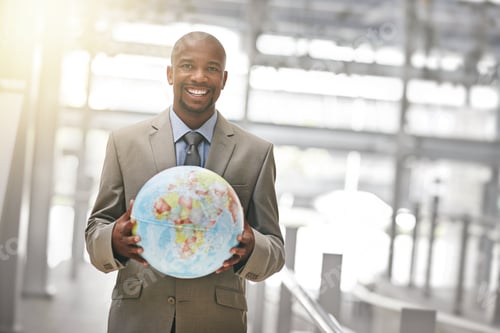 Preview: Ready to conquer the business world. Cropped portrait of a businessman holding a globe.
