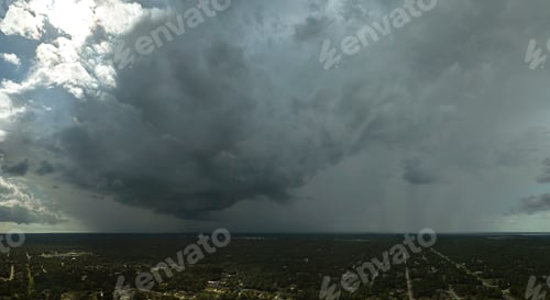 Preview: Landscape of dark ominous clouds forming on stormy sky during heavy thunderstorm