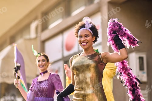 Preview: Cheerful black woman having fun on Mardi Gras street carnival.