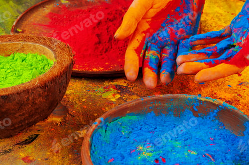 Preview: Hands holding Holi powder paint, view from above
