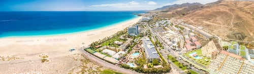 Preview: White sandy beach and blue water in Morro Jable, south of Fuerteventura, Canary islands