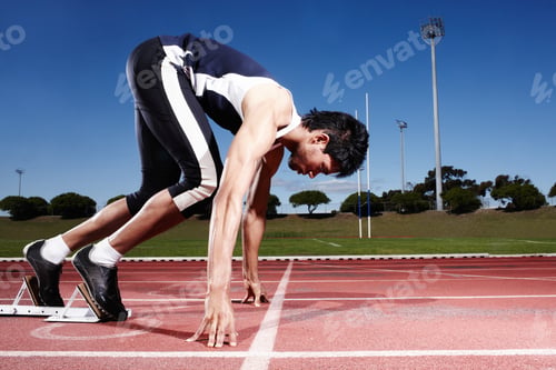 Preview: The process of preparation. A young runner getting ready for a race.
