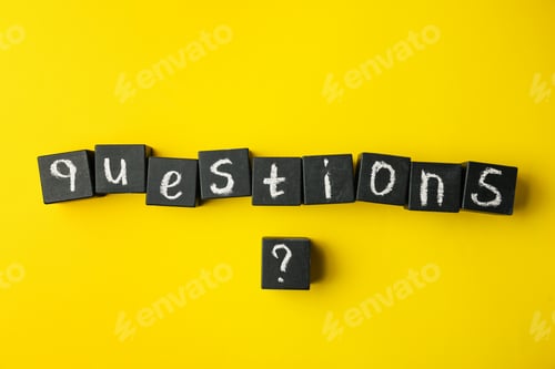 Preview: Word QUESTIONS and query mark with black cubes on yellow background, flat lay