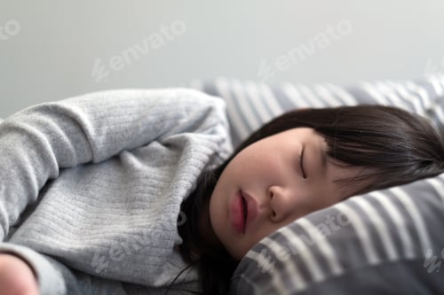 Preview: Child girl sleeping on bed