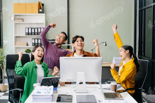 Preview: Happy businesspeople while collaborating on a new project in an office. Group of diverse