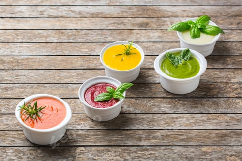 Preview: Set of seasonal fall autumn creamy soups on a table