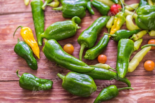 Preview: Closeup shot of fresh vegetables: peppers, tomatoes on wooden background