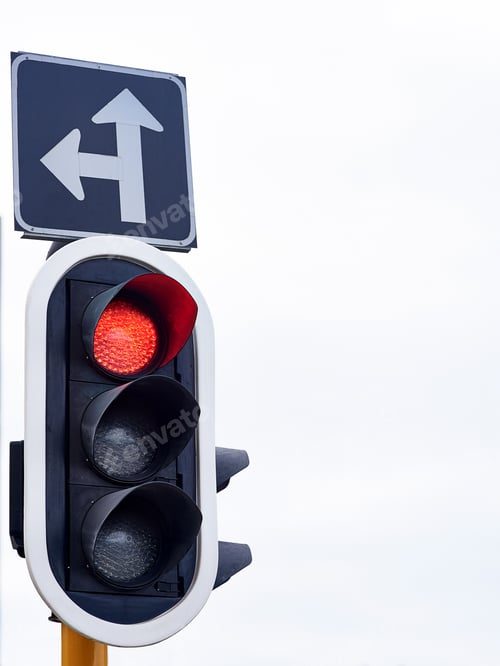 Preview: Signalling to stop. Shot of traffic lights against a gray sky.