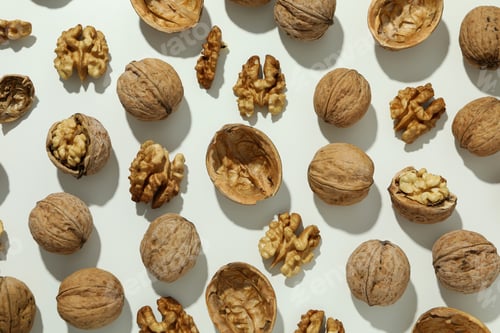 Preview: Flat lay composition with walnuts on brown background