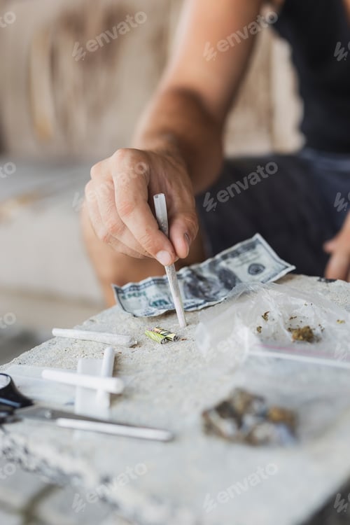 Preview: Man rolling a joint