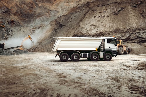 Preview: Industrial dumper trucks working on highway construction site