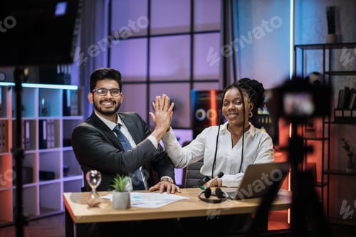 Preview: Positive multiracial partners giving high five, african american businesswoman and indian broker