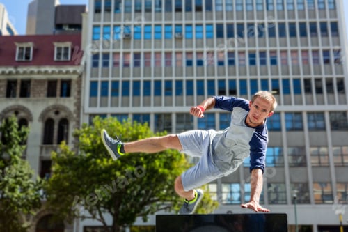 Preview: Man doing parkour in the city on a sunny day