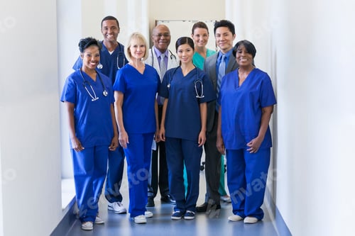 Preview: Smiling portrait multi ethnic team providing healthcare modern medical facility