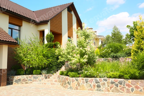 Preview: Landscape with modern house and beautiful garden on sunny day