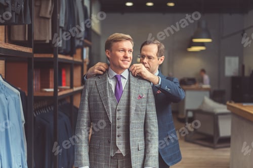 Man Being Fitted for Suit in Tailor Shop