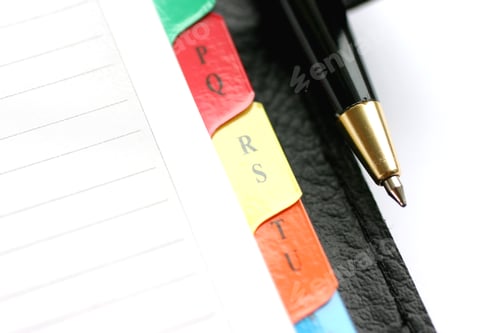 Preview: Address book with alphabet and pen closeup