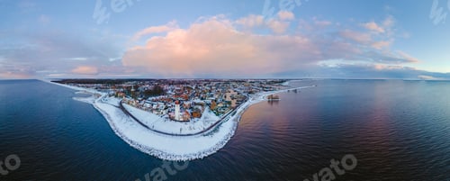 Preview: Lighthouse of Urk during winter with snow in the Netherlands during sunset