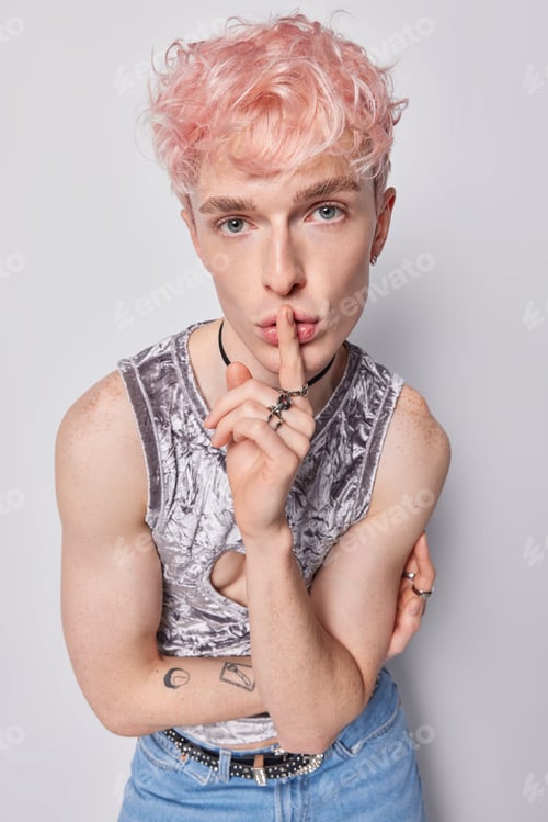 Preview: Mysterious guy with non traditional sexual orientation shows gesture of silence tells secret