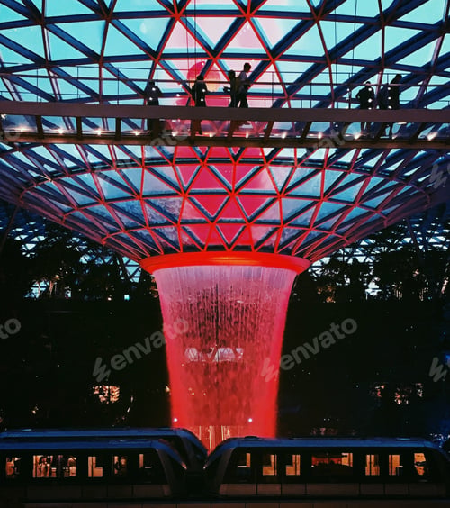Preview: People On a Bridge with a Towering Waterfall
