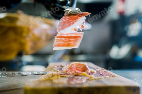 Preview: Delicious slice of jamon in forceps