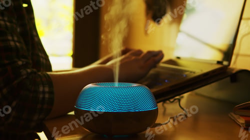 Preview: Silhouette of blue led essential oil diffuser steaming
