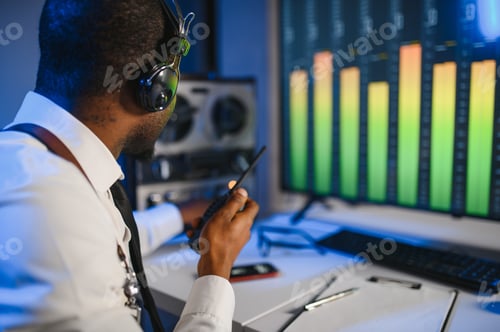 Preview: Secret agent listens on the reel tape recorder. Officer wiretapping in headphones
