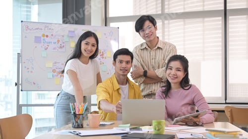 Preview: Successful business team gather in boardroom and smiling posing for camera.Teamwork concept.