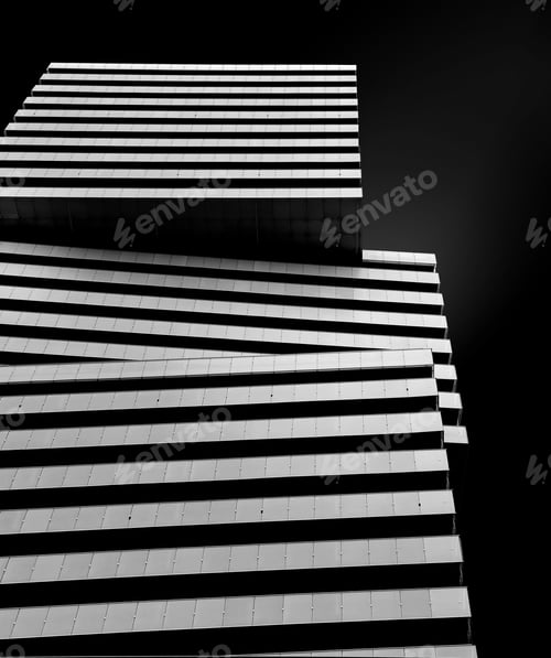 Preview: Vertical greyscale shot of big square blocks n a black background