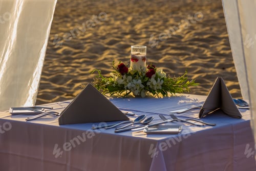 Preview: Dinner table for two at the beach
