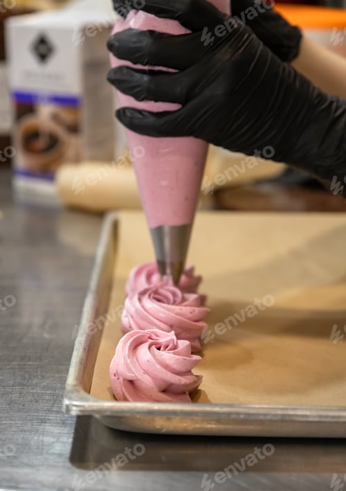 Preview: Process of marshmallow making. Chef squeezing meringue dessert from pastry bag