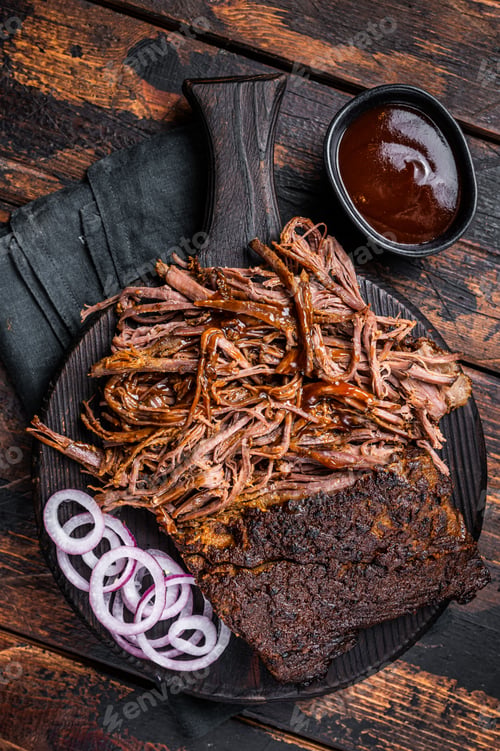 Preview: Traditional barbecue wagyu pulled beef on wooden board. Wooden background. Top view