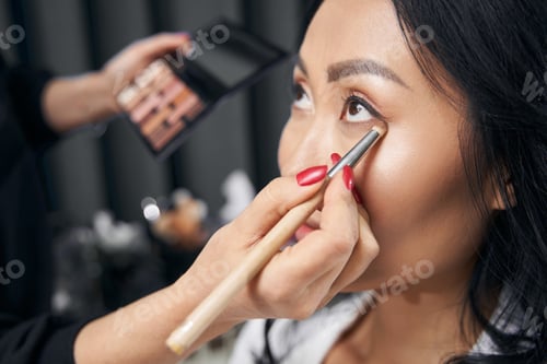 Preview: Charming woman getting professional visage in bright modern salon