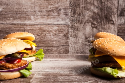 Preview: Delicious home made burgers on wooden plate
