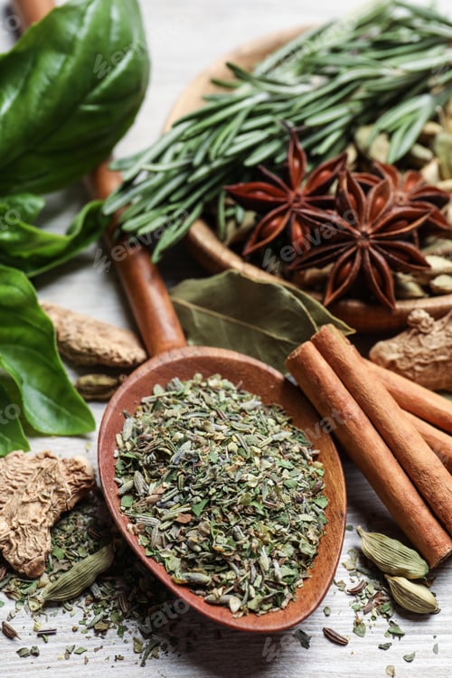 Preview: Different natural spices and herbs on wooden table, closeup