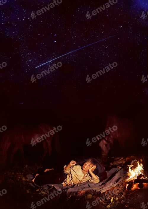 Preview: a boy in the Russian countryside lies near the fire and looks into the starry sky