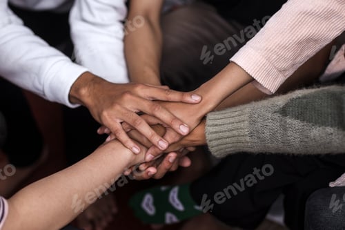 Preview: Group of people putting hands together