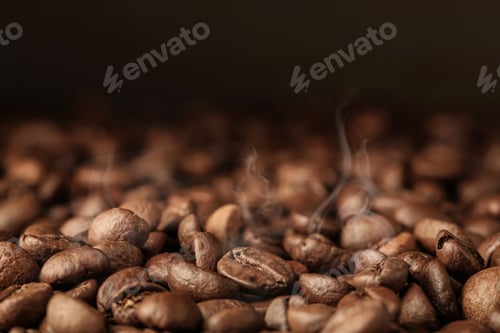 Preview: Heap of aromatic roasted coffee beans, closeup