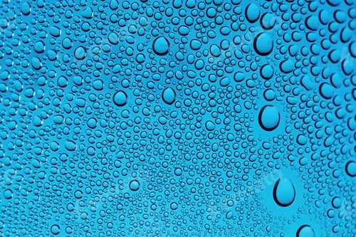 Preview: Drops of water on a blue background from close-up