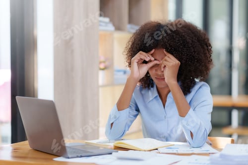 Preview: Young business woman worried about problem at work and stressed about problem with laptop computer.