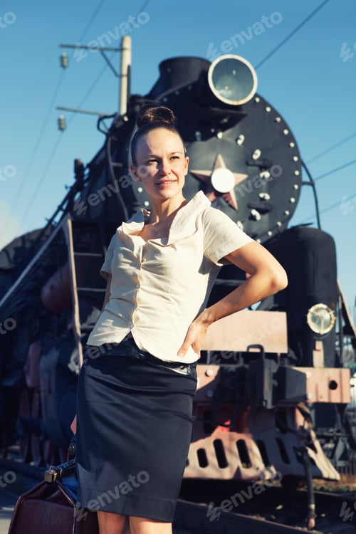 Preview: Woman standing on the platform near the retro train