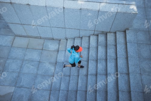 Preview: Fitness sports woman running up stairs in city