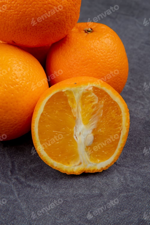 Preview: side view of fresh ripe oranges isolated on black background