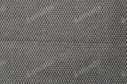 Preview: Knitted texture. Texture of jacquard fabric with gray geometric pattern. Crochet mosaic pattern.