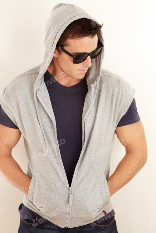 Preview: Hes really cool. A young man dressed casually with a hoodie and sunglasses.